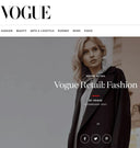 Vogue Retail Fashion article header with model in dark coat, cashmere coat in Vogue feature