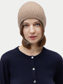 front view of woman wearing a beige knit beanie against a plain background  #color_taupe
