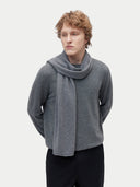 man wearing a gray scarf, sweater and black pants #color_dim-gray