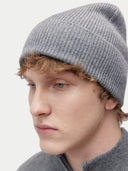 side view of a man wearing a gray beanie #color_dim-gray