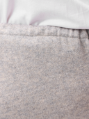Close-up of gray pants with a white shirt underneath #color_dawn-blue