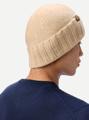 back view of Person wearing a beige knit beanie on a white background #color_beige