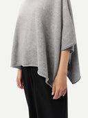 a zoomed-in shot of a gray poncho worn by a person on a white background #color_high-rise