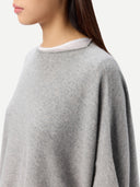 close up of a gray poncho worn by a person on a white background #color_high-rise