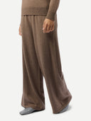 Brown wide-leg pants worn by a person on a white background #color_taupe