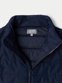 Navy blue jacket with Gobi brand label on a light gray background #color_navy-blazer
