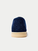 back side of a navy blue shoe with beige sole on a light gray background #color_navy