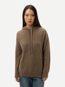 Woman wearing a brown hoodie on a white background #color_taupe
