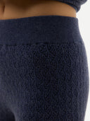 Close-up of a dark blue textured fabric on a white background #color_crown-blue