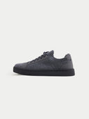 A side profile view of a low-top sneaker featuring a gray-colored knit upper and matching laces. The shoe has a smooth suede-like heel counter and eyelet overlays in the same tone, in a white background.#color_frost-gray