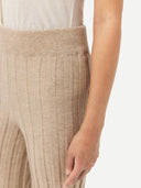 close up of a beige rib cashmere pants #color_warm-grey