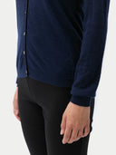 close up of a navy cardigan and black pants on a white background #color_mood-indigo