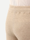 back of a beige textured pants #color_warm-grey