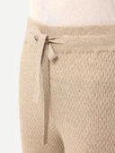 close up front view of a beige cashmere textured pants with rope belt #color_warm-grey