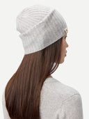 back view of person wearing a gray knit beanie on a white background #color_high-rise