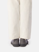 back view of white pants and gray knitted sneakers with brand name "GOBI" embossed in the center  #color_frost-gray