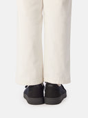 back view of white pants and black knitted cashmere sneaker with brand name "GOBI" #color_black