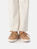 close up front view of white pants and almond color cashmere sneakers with white socks #color_toasted-almond