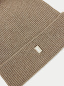 back view of a beige beanie with a small label "GOBI" #color_taupe