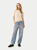 front view of a beige sweater and light blue jeans on a white background #color_off-white