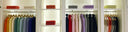 Closet with clothes on hangers and folded at the top