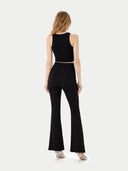 back view of a black sleeveless top and black flared pants on a white background #color_black