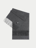 A gray cashmere fringed scarf with a twill weave pattern.