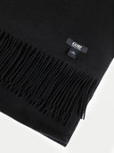 A close-up of a black fringed scarf with a small black GOBI brand tag, shown on a clean white background.