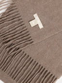 close up of a brown fringed scarf with a label "GOBI ORGANIC"  #color_taupe