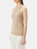 close up side view of a beige sleeveless top and white pants #color_warm-grey