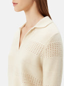 close up of a white sweater with collar and small holes #color_off-white