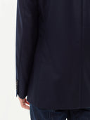 close up back view of a navy blazer #color_navy