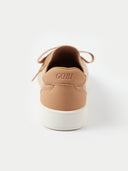 A close-up rear view of a camel-colored sneaker, focusing on the suede-like heel counter which features the brand name "GOBI" embossed in the center. The shoe sits on a thick white midsole against a plain white background.
#color_toasted-almond