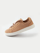 A side profile view of a low-top sneaker featuring a camel-colored knit upper and matching laces. The shoe has a smooth suede-like heel counter and eyelet overlays in the same tone, in a white background. #color_toasted-almond