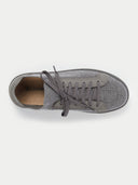 A top-down view of a low-top sneaker featuring a heather gray knit upper with matching gray laces and suede-like overlays around the eyelets and toe. The interior shows a tan insole with a partial "CASHMERE" logo, all set against a light gray background. #color_frost-gray