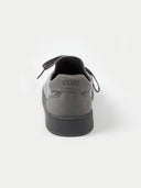 A close-up rear view of a gray-colored sneaker, focusing on the suede-like heel counter which features the brand name "GOBI" embossed in the center. The shoe sits on a thick white midsole against a plain white background.#color_frost-gray