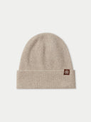 a beige beanie with a small brand logo