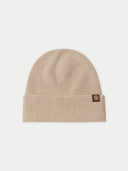 Beige knit beanie with a brand logo on a light gray background #color_beige