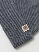 close up of a gray beanie with a small brand logo #color_dim-gray