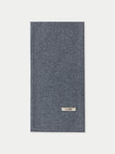 flat lay of a gray jersey knit scarf with a label "GOBI" on a light gray background #color_dim-gray