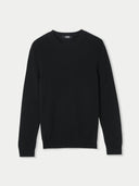 A black cashmere crew neck sweater against a neutral background #color_black