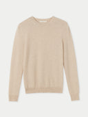 A beige, crew neck cashmere sweater on a light gray background. #color_beige