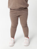 close up of brown kids' cashmere pants with pockets #color_taupe