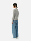 side back view of a gray cardigan sweater with blue jeans #color_dawn-blue