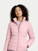 Woman wearing a pink puffer jacket on a light gray background #color_potpourri