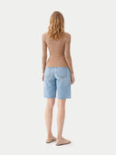 back view of a beige sweater and light blue shorts on a white background #color_timber-wolf