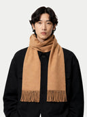 Person wearing a beige scarf against a white background #color_sheepskin