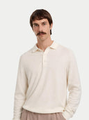 Man wearing a cream sweater over a white shirt on a light gray background #color_marshmallow