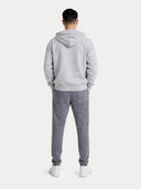 Person wearing a gray tracksuit on a white background #color_dim-gray
