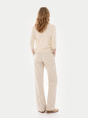 back view of a beige outfit on a white background #color_off-white